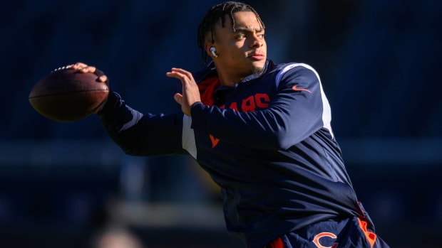 Bears quarterback Justin Fields throws a pass during warmups before a game.